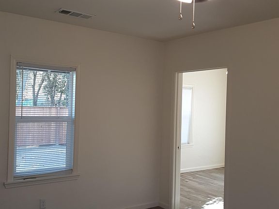 Living room - window to backyard and view into back bedroom