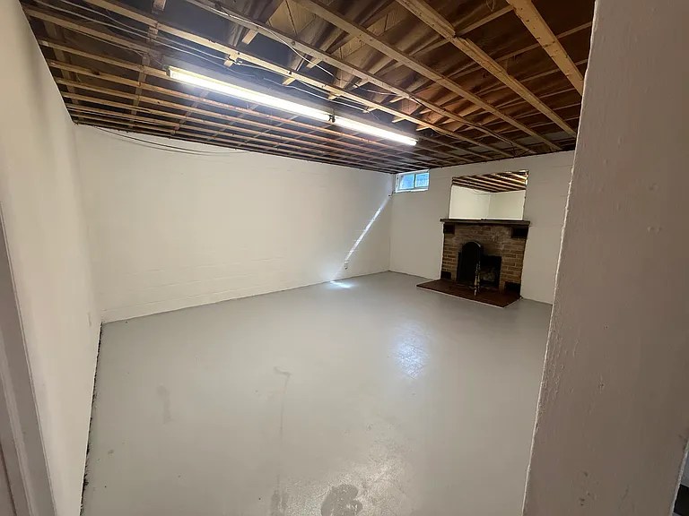 Basement. Fireplace is just for decor. Non - working.