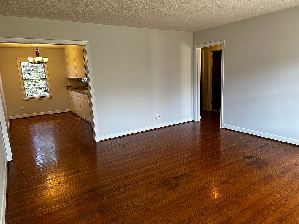 Living room open to dining and kitchen