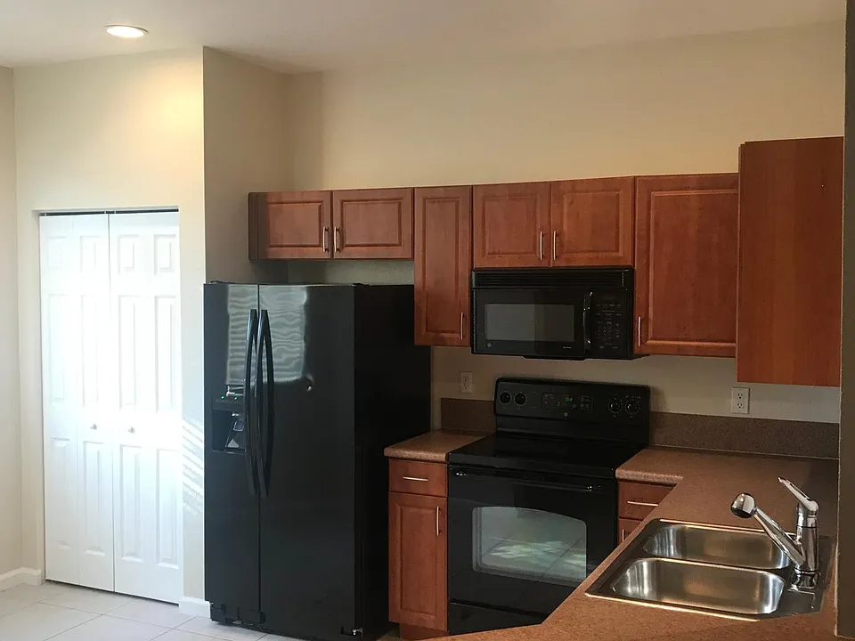 Spacious kitchen with large pantry and eating space. Extra storage under the stairs.