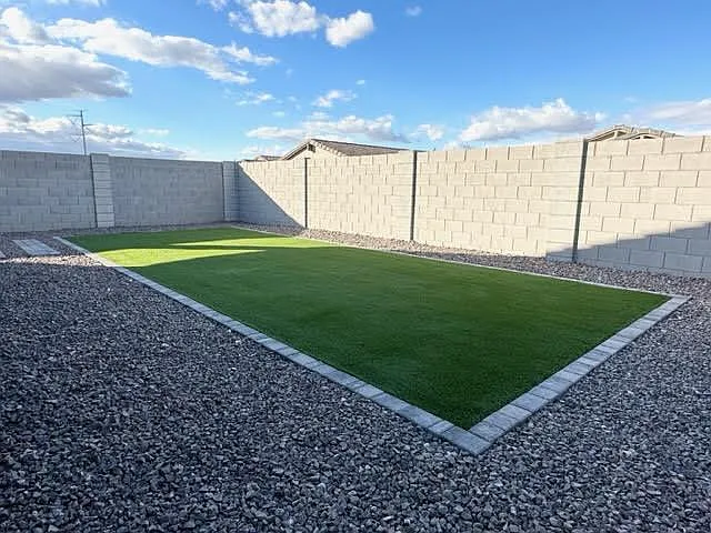 Low-maintenance backyard with artificial turf