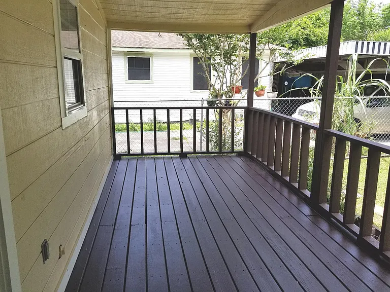 The back porch covered with porch light. Side is the Utility room for storage.