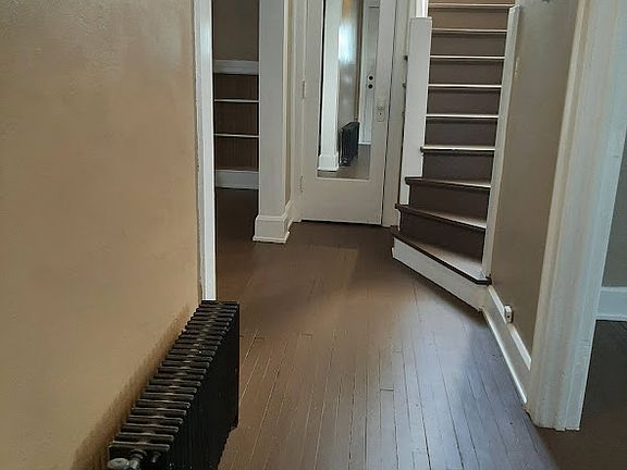 Entrance hall to Dining room on right, living room on left, closet and stairs to second level