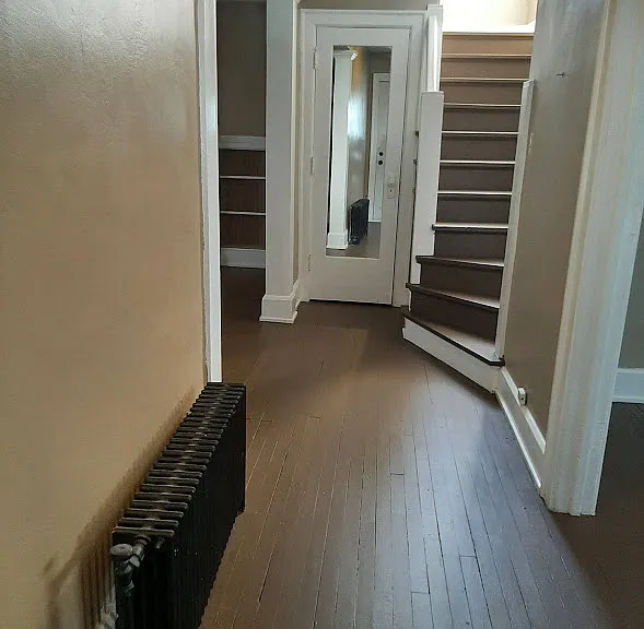Entrance hall to Dining room on right, living room on left, closet and stairs to second level
