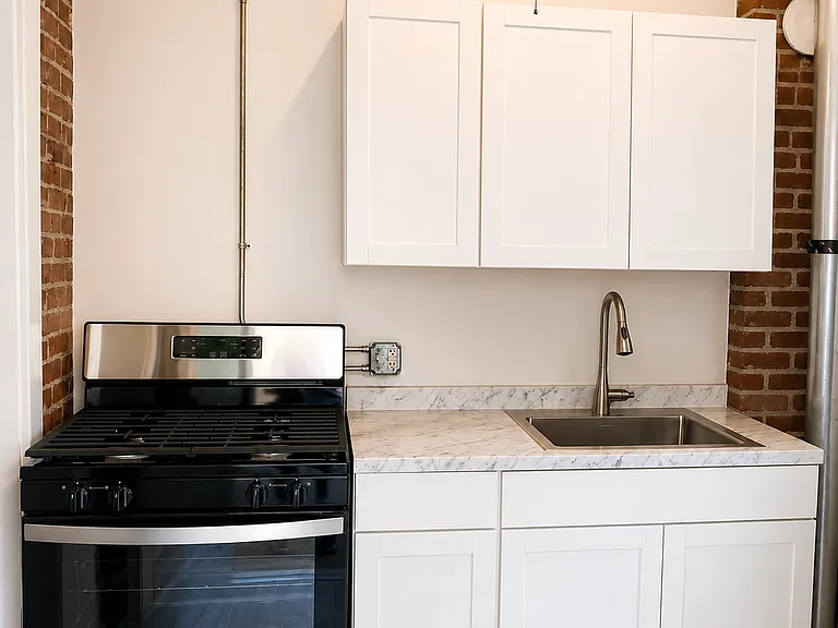 New kitchen with new stainless steel appliances.