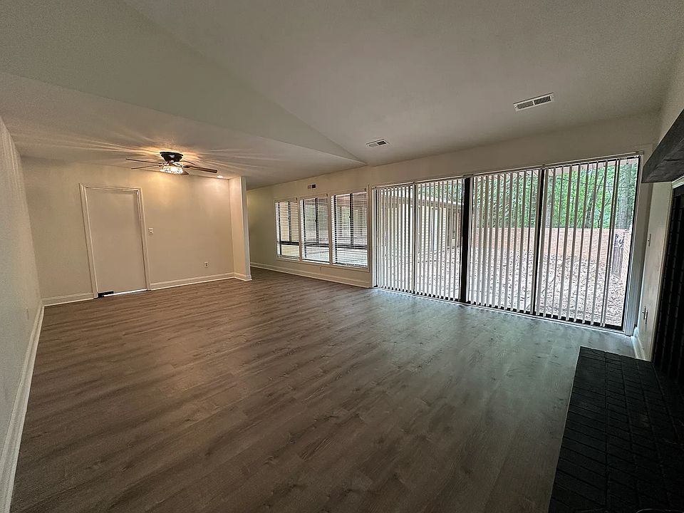 living room with dining area in the back of the room