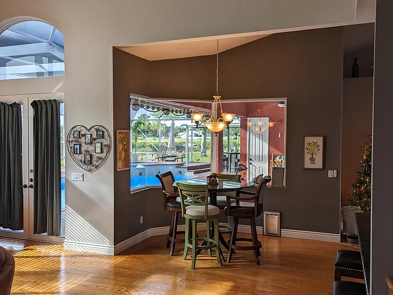 Living room, view from staircase toward dining nook.