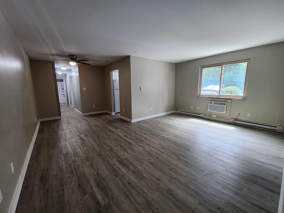 Living room with built in ac unit.