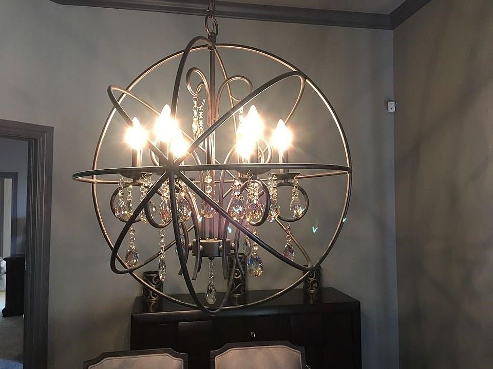 Designer light fixtures are a few of the many upgrades in this beautiful home!