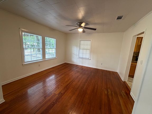 Dining area with open floor plan and hardwood floors