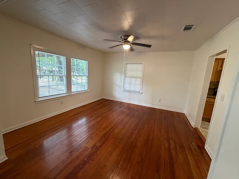 Dining area with open floor plan and hardwood floors