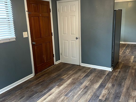 Livingroom showing entrance door and closet