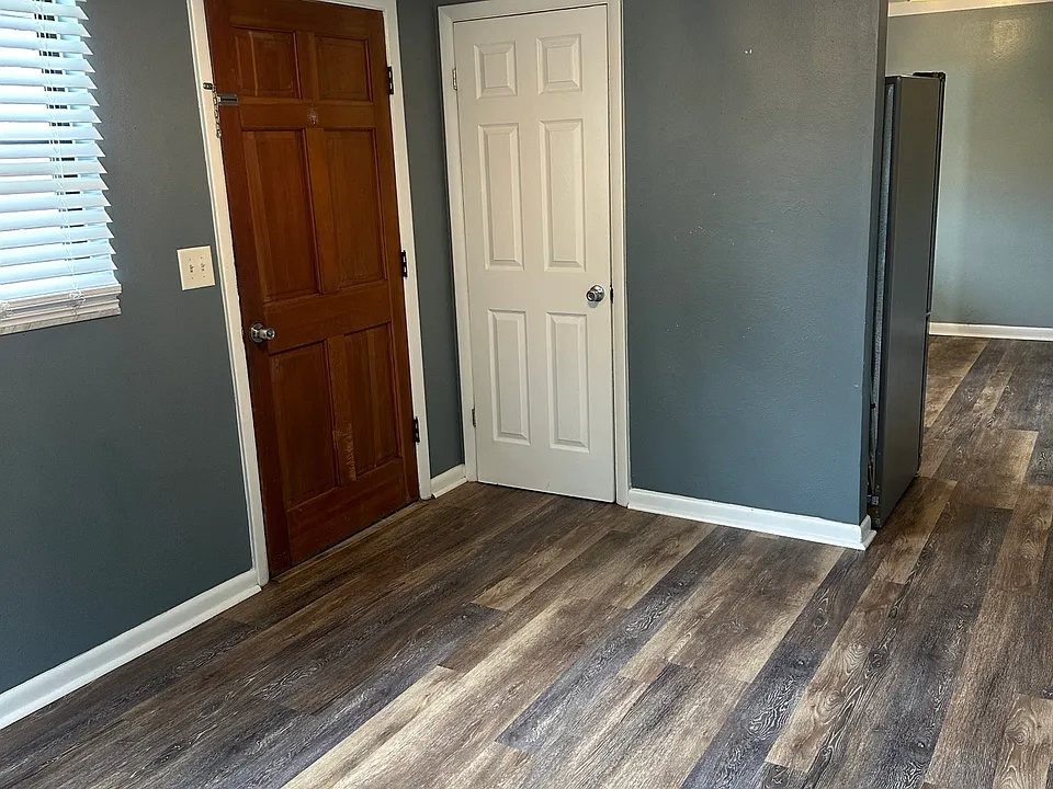 Livingroom showing entrance door and closet
