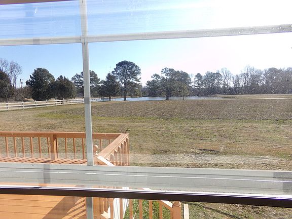 Standing in Dining room overlooking pond