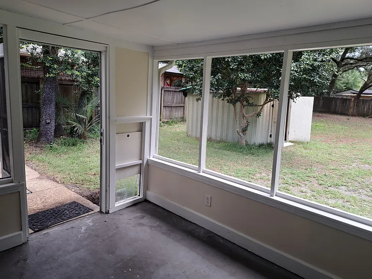 Back patio/screened in porch & huge back yard