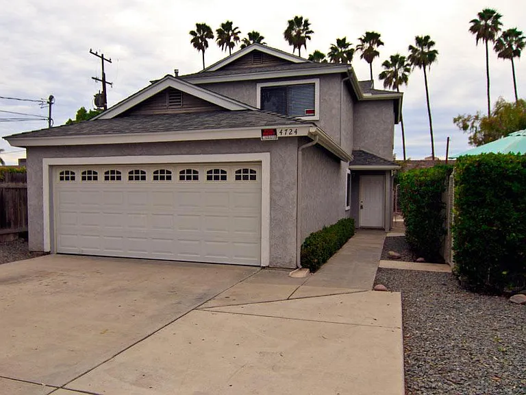 This house sits off the street and is two stories. 3 bedrooms upstairs and 1 downstairs.