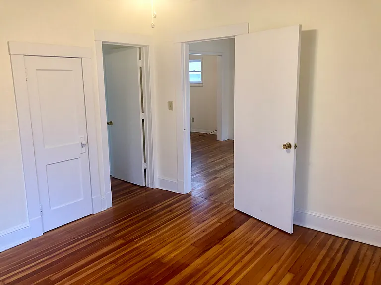 Looking from front bedroom into main living space.