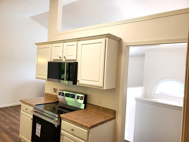 New Stainless Steel Microwave & Range in Newly Painted Kitchen