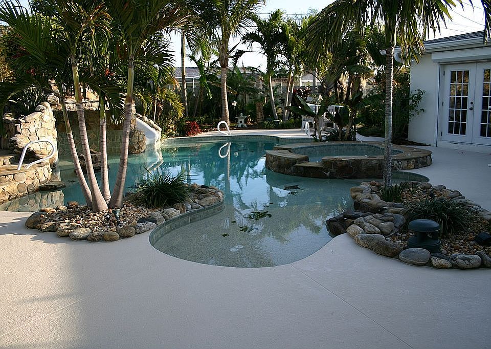 Back yard pool, slide, spa, waterfall & solar