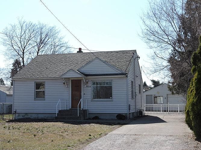 FRONT AREA VIEW OF HOUSE, GARAGE AT END OF DRIVEWA