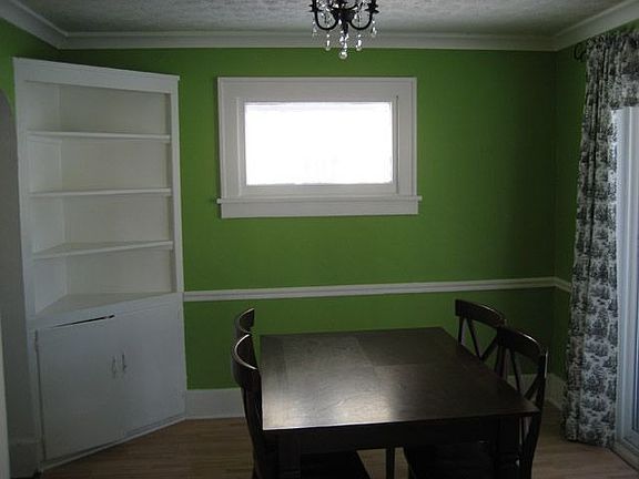 Elegant dining room with built in hutch & new sliding glass doors to back deck