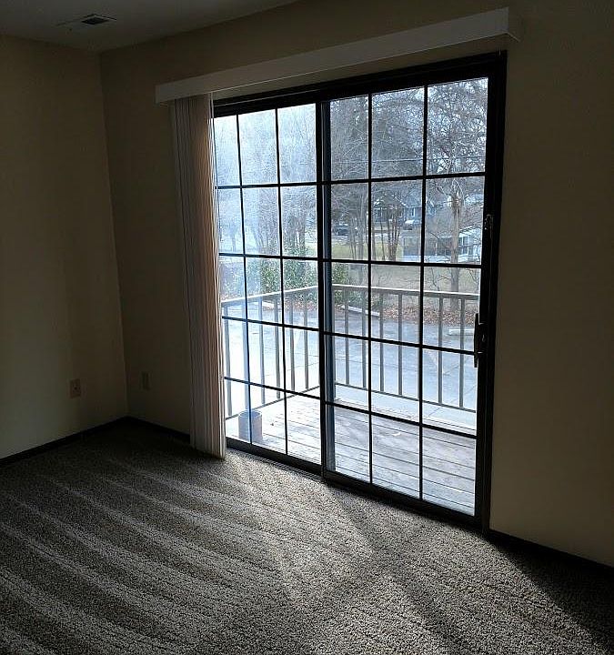 Living room with sliding glass door and private balcony!