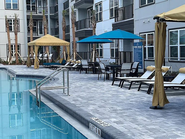 Experience relaxation at our upscale poolside haven, perfect for sunny days.
