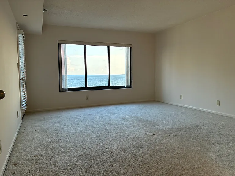 Primary bedroom with balcony access