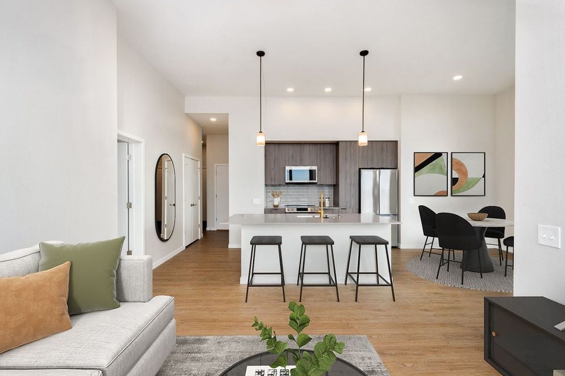 Signature Collection kitchen and living area with hard surface flooring