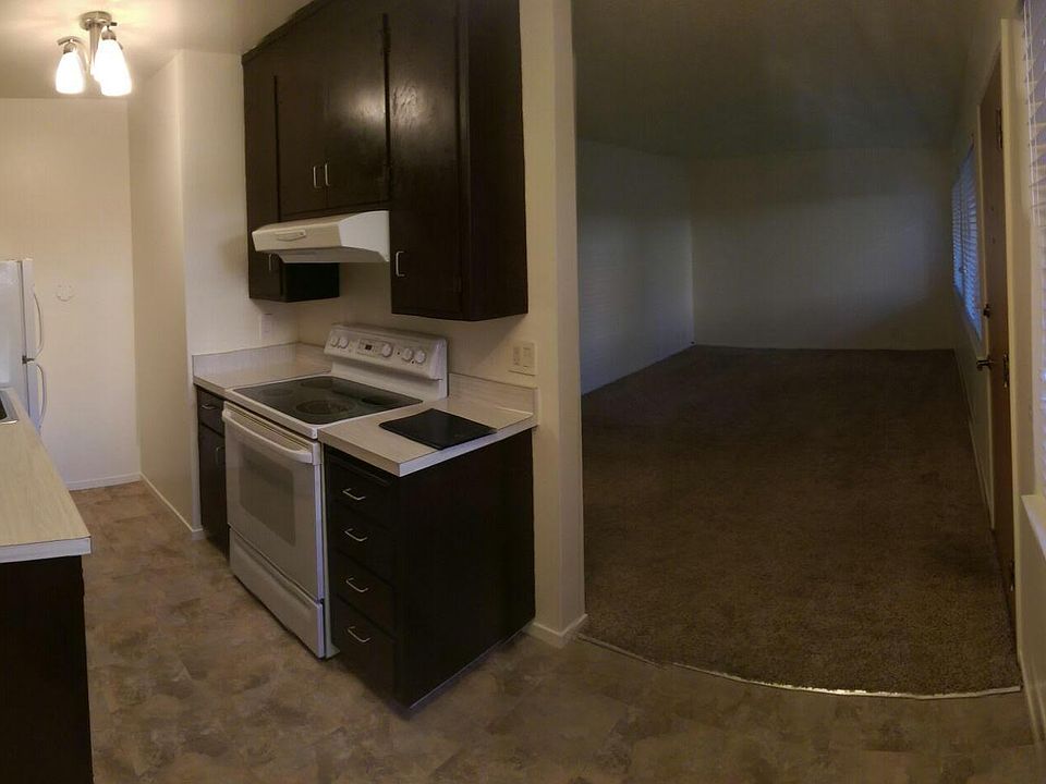 dining room looking into kitchen and living room