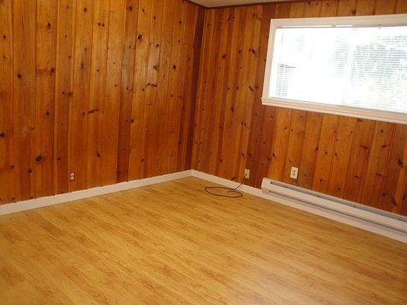 Bedroom with knotty pine
