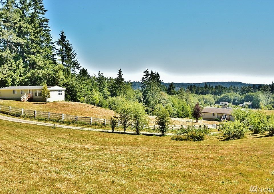 Beautiful!!  2-parcels, two houses...Go pass the mobile home to see big house below