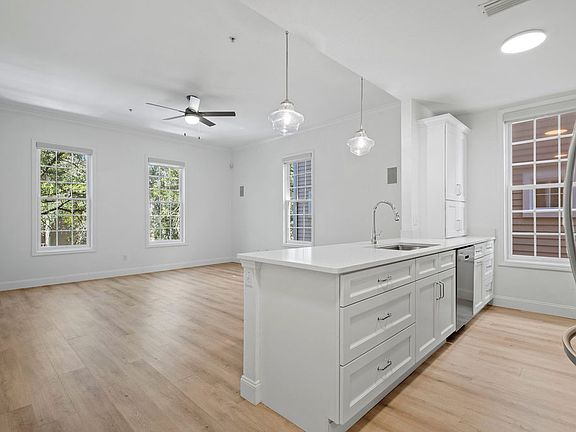 Updated kitchen with quartz countertop, high end cabinetry, stainless steel appliances