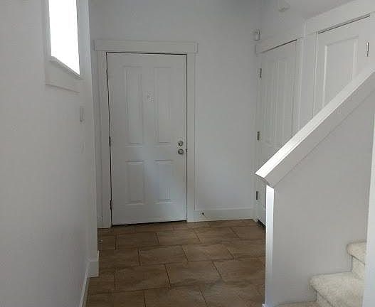 main entrance, entrance from garage, and under stair storage
