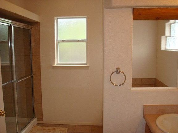 Master Bathroom Also Features Tile Shower and Jet Garden Tub.