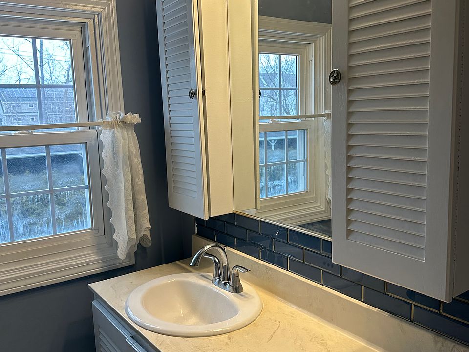 Bathroom faces north with carports behind
