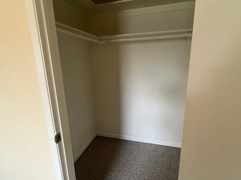 Bedroom Walk In Closet with Shared Bathroom