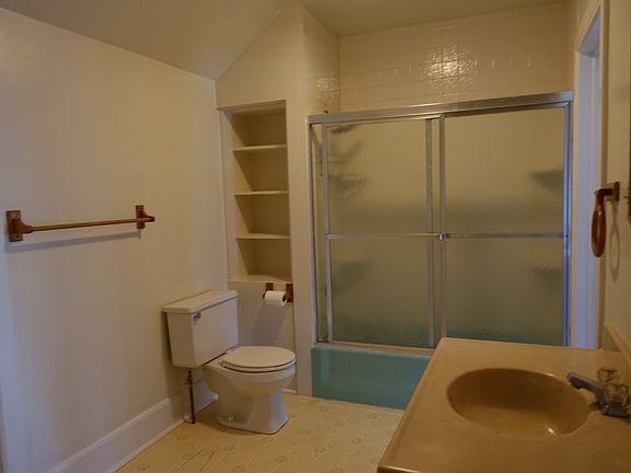 bathroom with closet and shelving