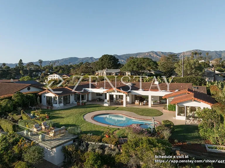Single-story estate with classic tile roof and expansive frontage