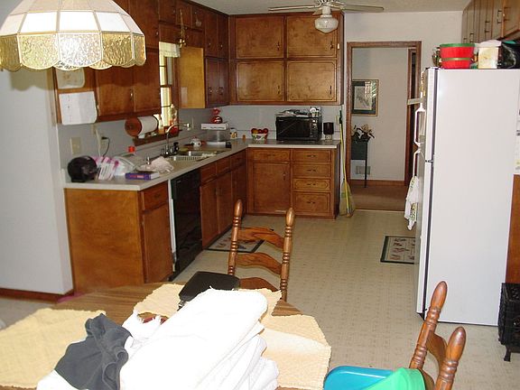 Dining area in front, kitchen in back, laundry out of frame to the left