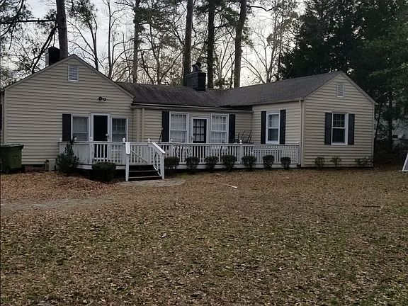 Back of house with deck