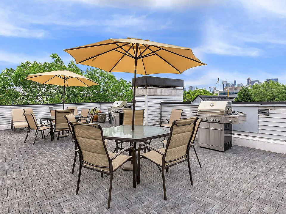 Enjoy al fresco dining with skyline views on this modern rooftop patio.