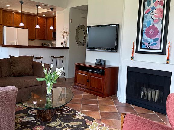 Living room with kitchen in the background