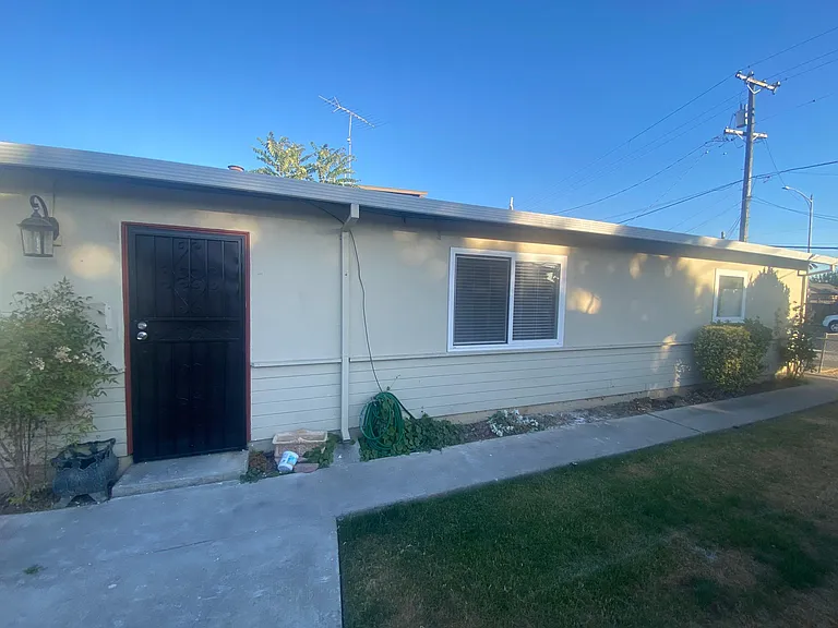 Front door/entrance with screen door.