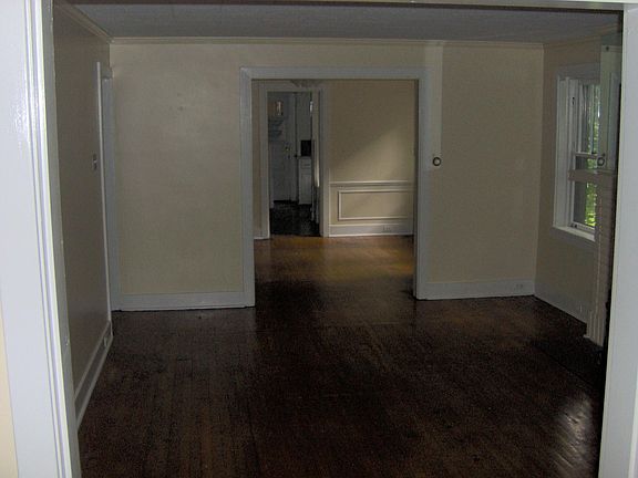 Large dining room, living room, and sunroom in the front of the unit