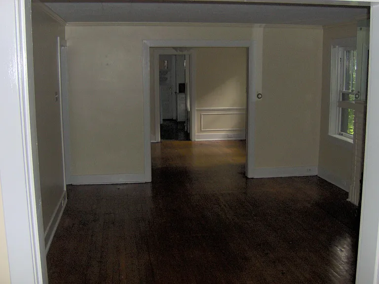 Large dining room, living room, and sunroom in the front of the unit