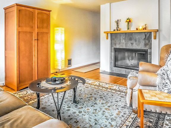 2nd floor Living room with working fireplace and hardwood floors.