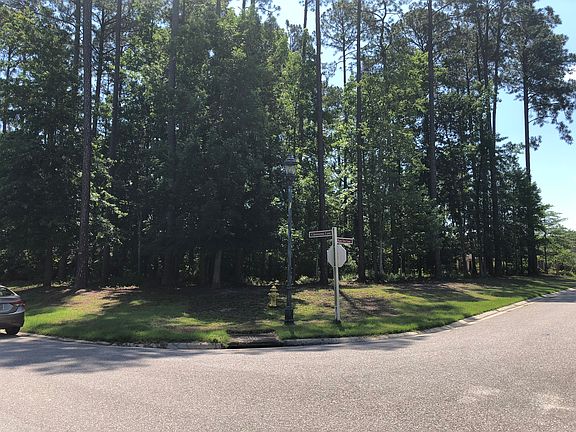 Front view of treed lot.