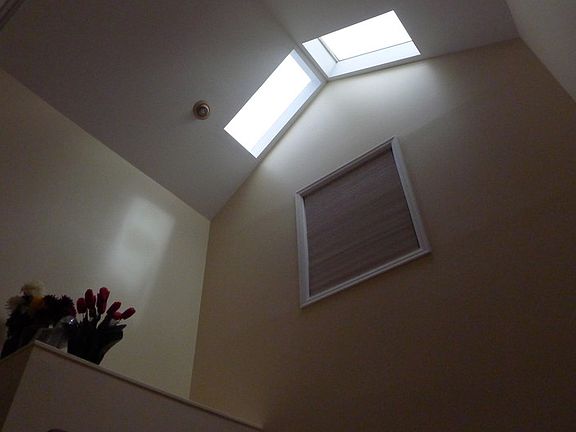 Gorgeous skylight gives plenty of natural light in foyer