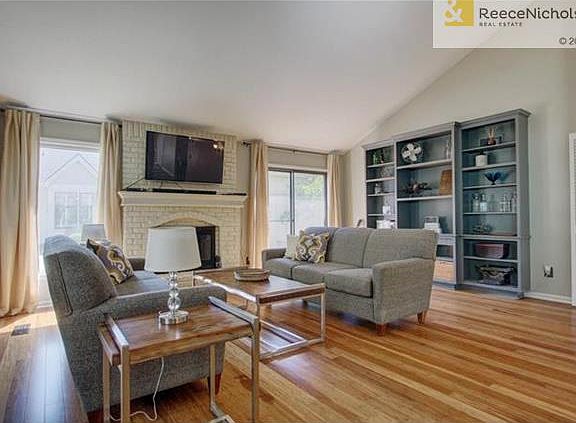 Living Room includes large built-in shelf and walks out to 1 of 2 fenced patios.